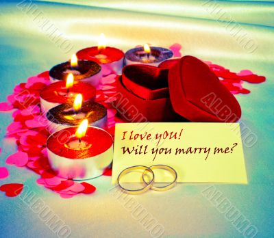 Blank card and two rings and candles