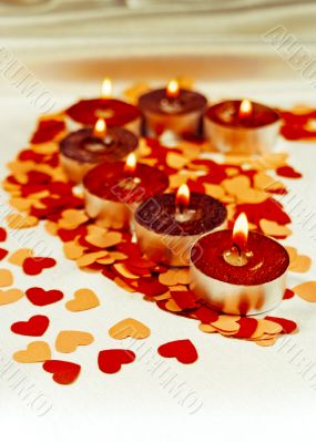 Burning candles heart shaped