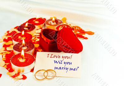 Blank card and two rings and candles