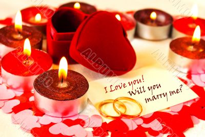 Blank card and two rings and candles