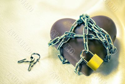 Heart shaped chocolate tied up with chains