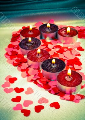 Burning candles heart shaped 