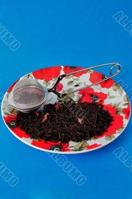 Plate with tea and tea infuser