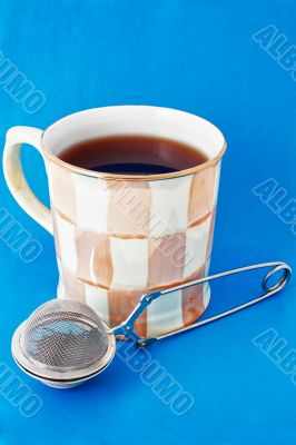 Cup of tea and tea infuser