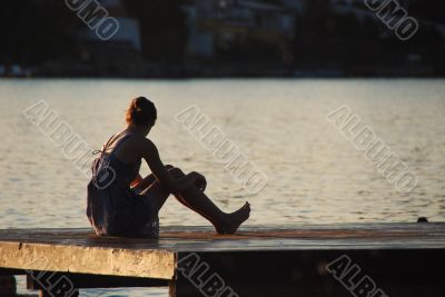 woman sitting at the bar