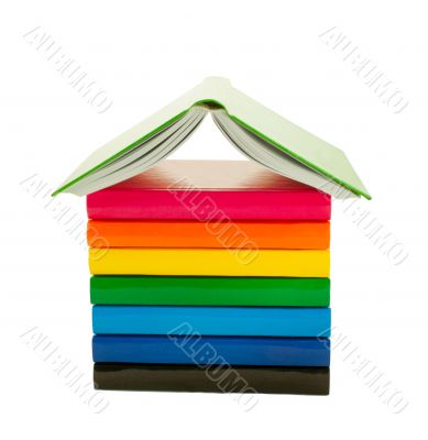 Stack of the colorful books isolated on white