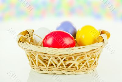Colorful Easter eggs in a basket