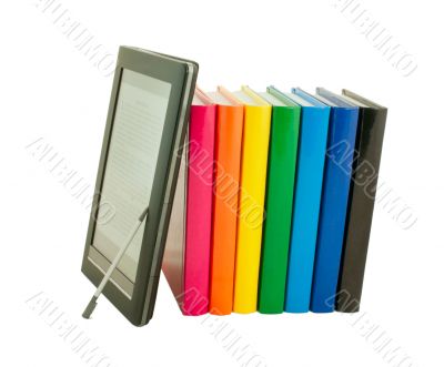 Stack of colorful books and electronic book reader