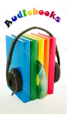 Row of books and headphones - Audiobooks concept