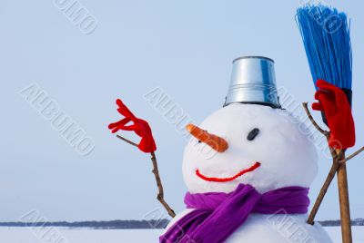 Lonely snowman at a snowy field