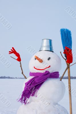 Lonely snowman at a snowy field