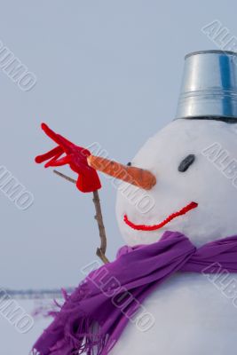 Lonely snowman at a snowy field
