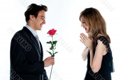 man gives a woman flowers