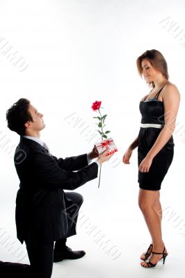 man gives a woman flowers