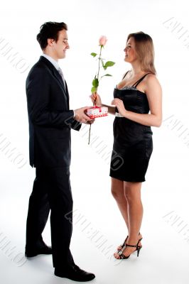 man gives a woman flowers