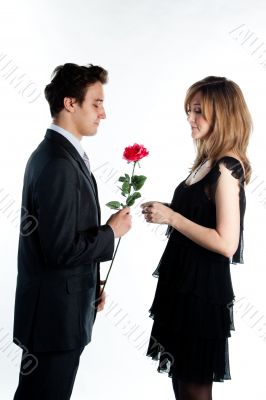 man gives a woman flowers