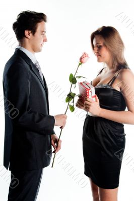 man gives a woman flowers