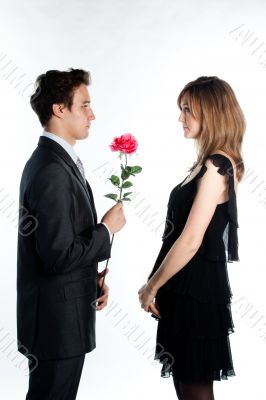 man gives a woman flowers