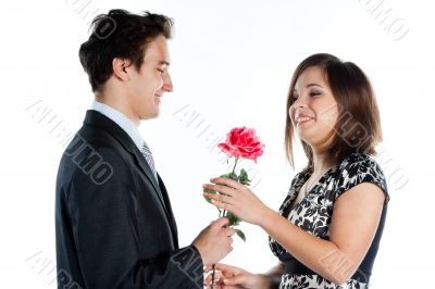 man gives a woman flowers