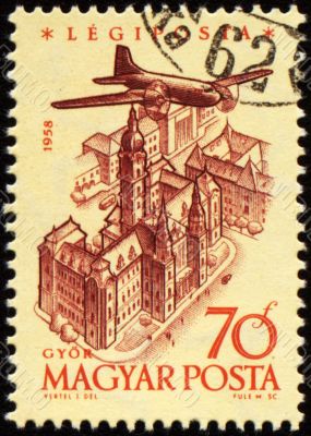Flying plane over the Gyor on post stamp