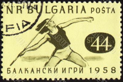 Javelin throwing on post stamp