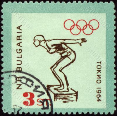 Jumping swimmer on post stamp