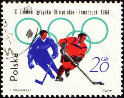Two hockey players on post stamp