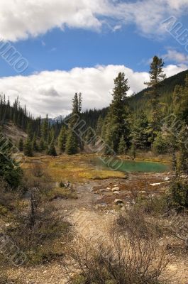 a small lake in the mountains