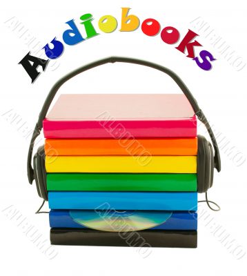 Stack of books and headphones - Audiobooks concept