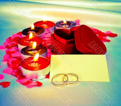 Blank card and two rings and candles