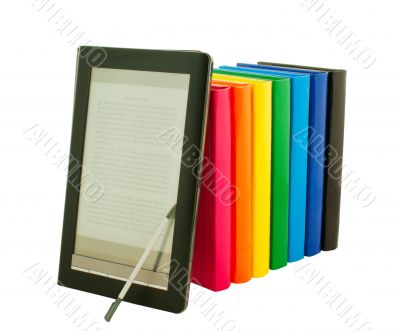 E-book reader with stack of printed books