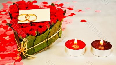 Two rings and a blank card with two candles
