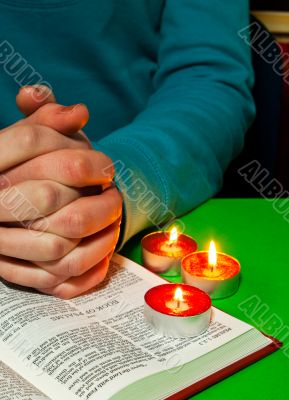 Female`s arms over the Book of Psalms