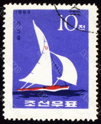 Yacht in a sea on post stamp