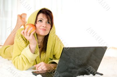 woman with laptop and apple