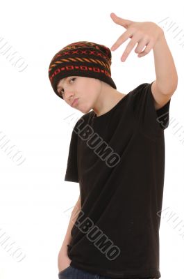 The teenager in a black vest and a hat