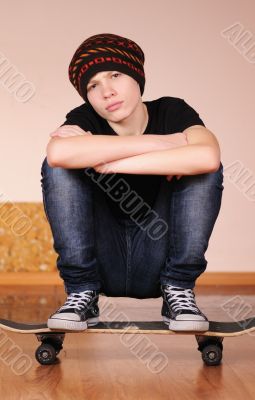 The teenager with a skateboard 