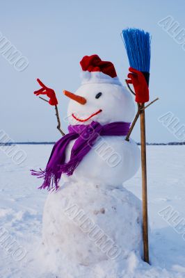 Lonely snowman at a snowy field