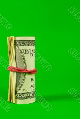 Roll of US dollars tied up with rubber