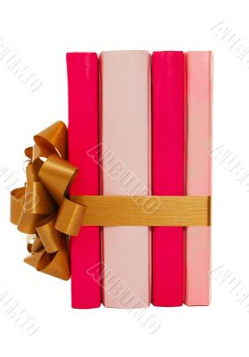 Four books tied up with ribbon