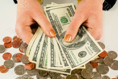 Female`s hands with 100 US dollar bills