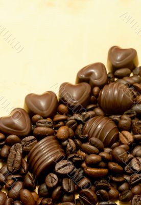Heart shaped chocolate candies and coffee beans