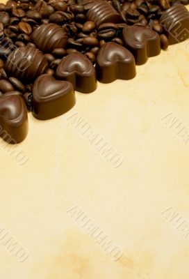 Heart shaped chocolate candies and coffee beans