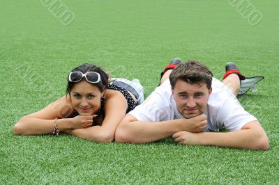 young couple is together on the football field
