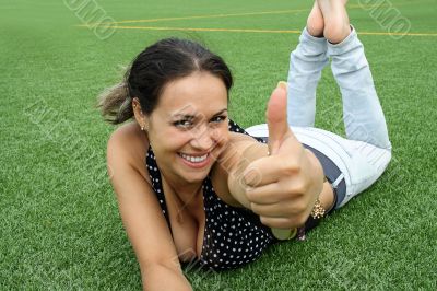 Happy smiling girl with thumbs up 