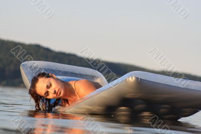 woman lying air mattress