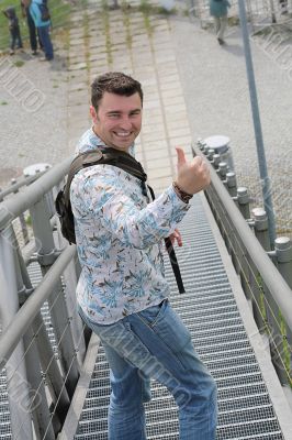 laughing man showing thumbs up