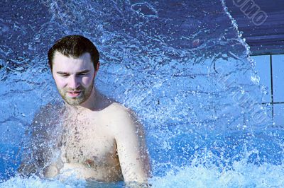 man relaxing in water