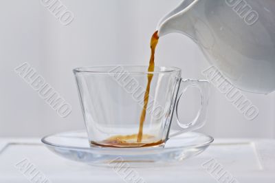 Pouring a small amount of coffee