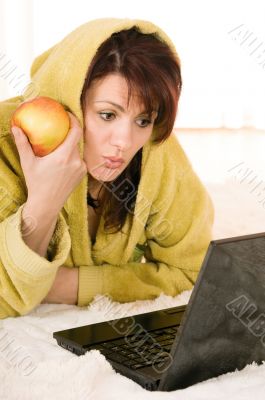 woman with laptop and apple